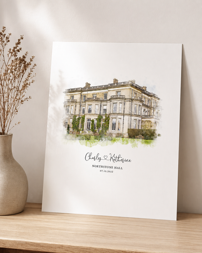 Portrait format watercolour print of a wedding venue with the couple's names and date beneath